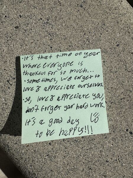 Handwritten sticky note with words of encouragement